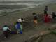 Having enjoyed the low tides, now the kids build with the sand on the beach