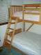 The ladder came out nice too. Here you can also see the futon around which the loft bed was designed and built.