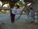 Hanging from the log arch